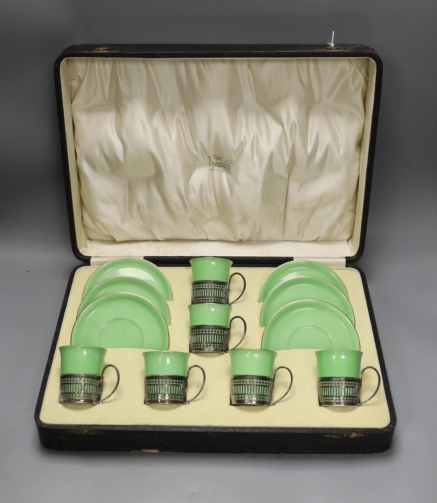 Boxed set of six Shelley 8775/4 green coffee cans and saucers in silver handle mounts